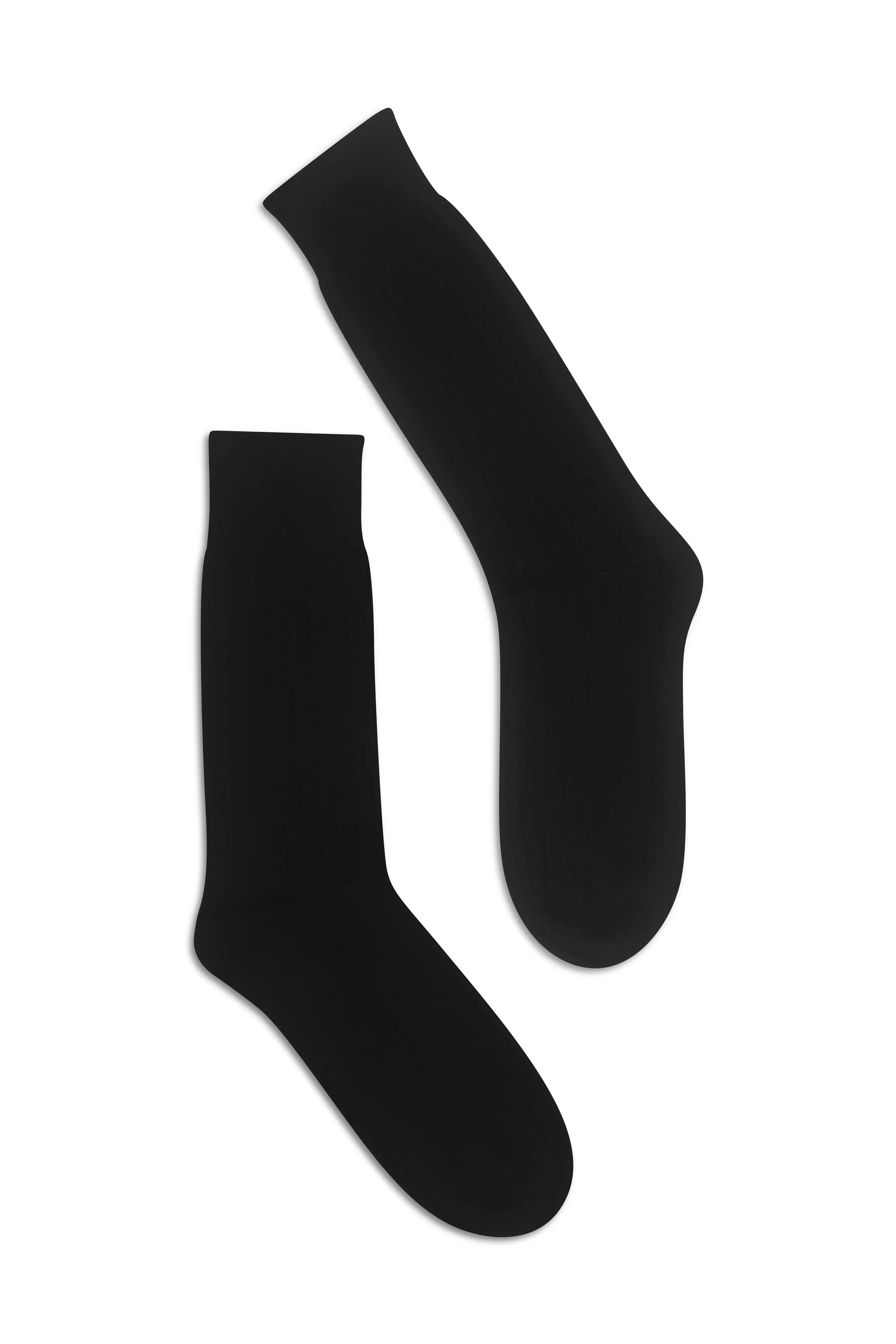 Pair of Black knee-high socks on a flat lay background