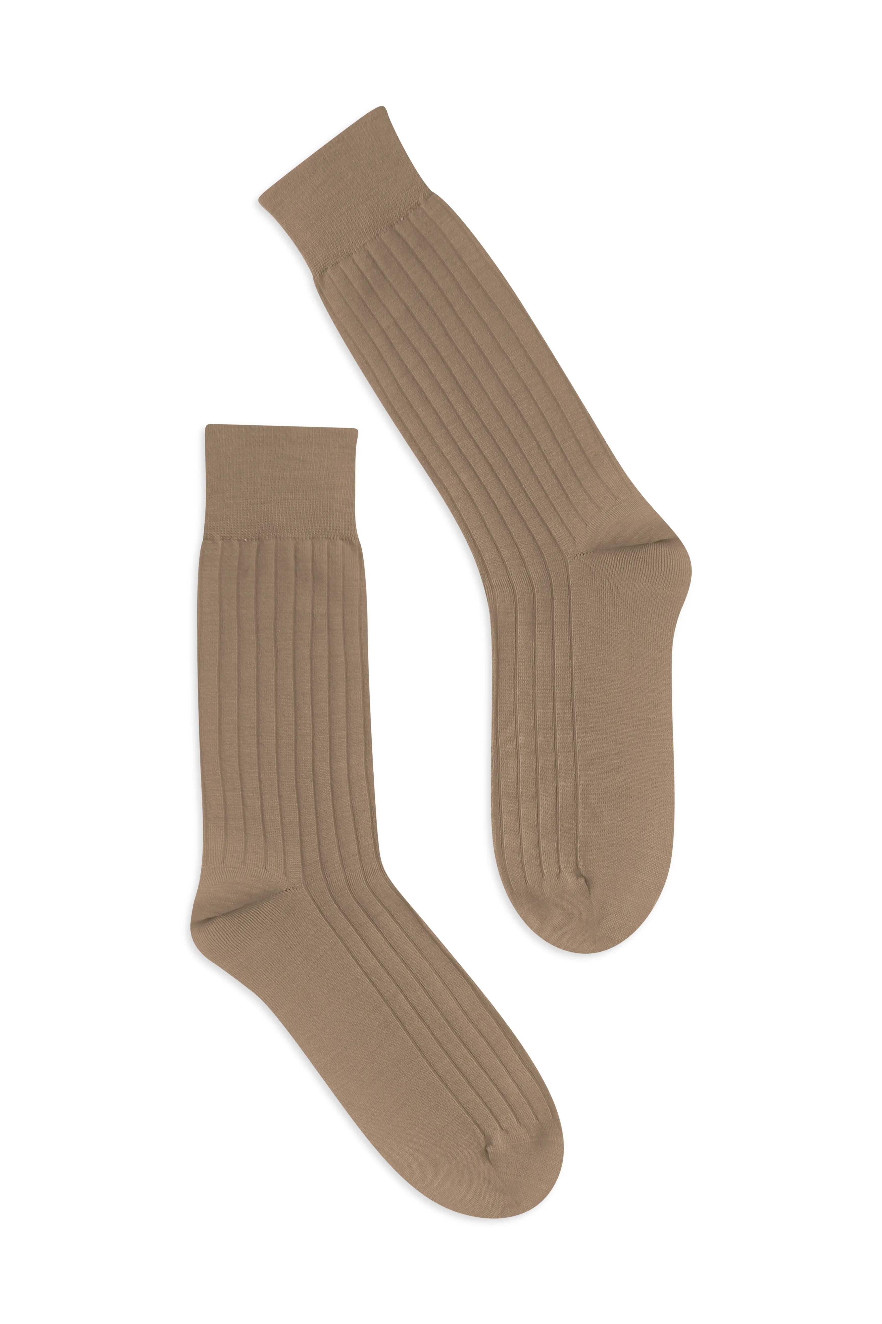 Pair of Latte knee-high socks on a flat lay background