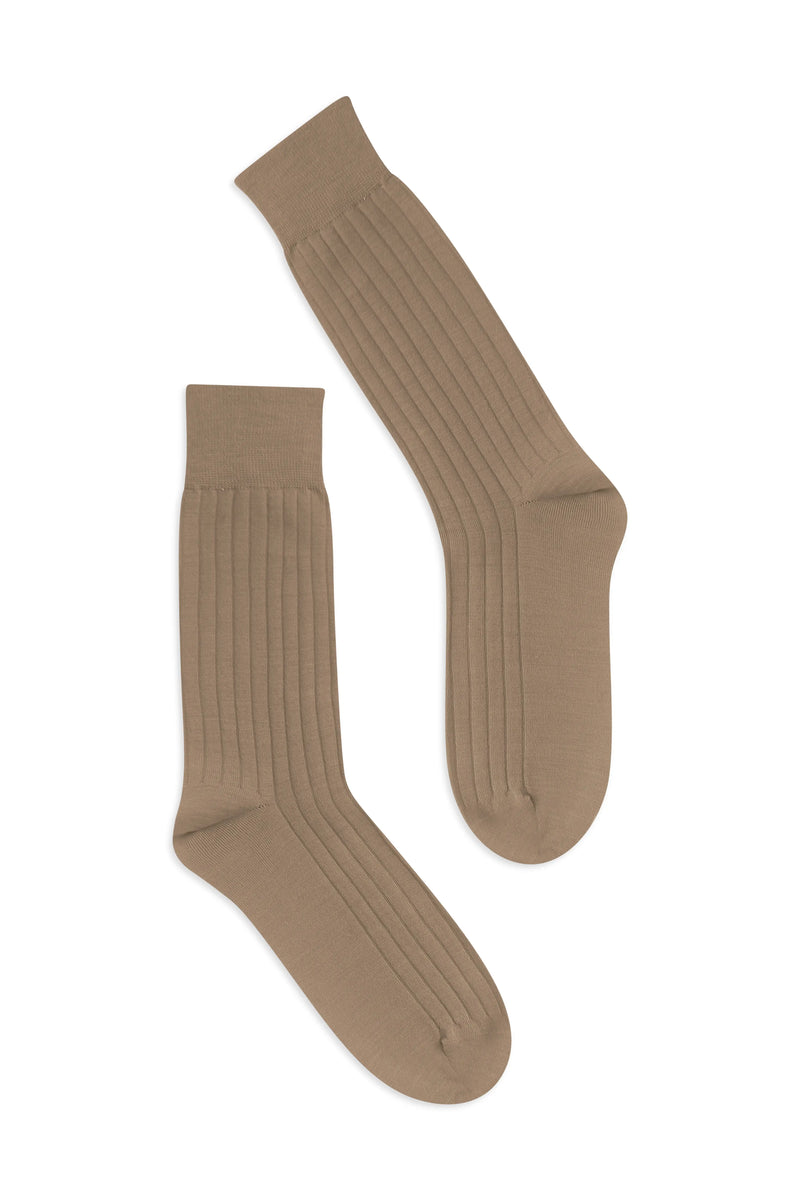 Pair of Latte knee-high socks on a flat lay background - Latte