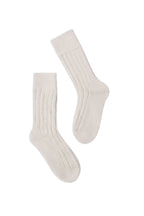 half british alpaca lounge socks in cream, pair laid flat on a background to highlight the ribbed knit structure and soft alpaca texture