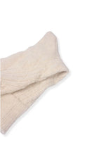 half british alpaca lounge sock in cream, folded neatly on a background to show the ribbed knit and soft alpaca texture