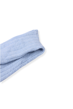 half british alpaca lounge sock in baby blue, folded neatly on a background showing the ribbed knit pattern and soft alpaca texture