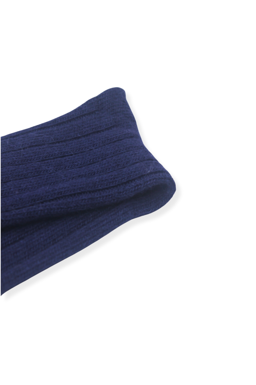 close-up of half british alpaca lounge sock in navy, folded to highlight the ribbed knit detail and fine alpaca wool texture on a background