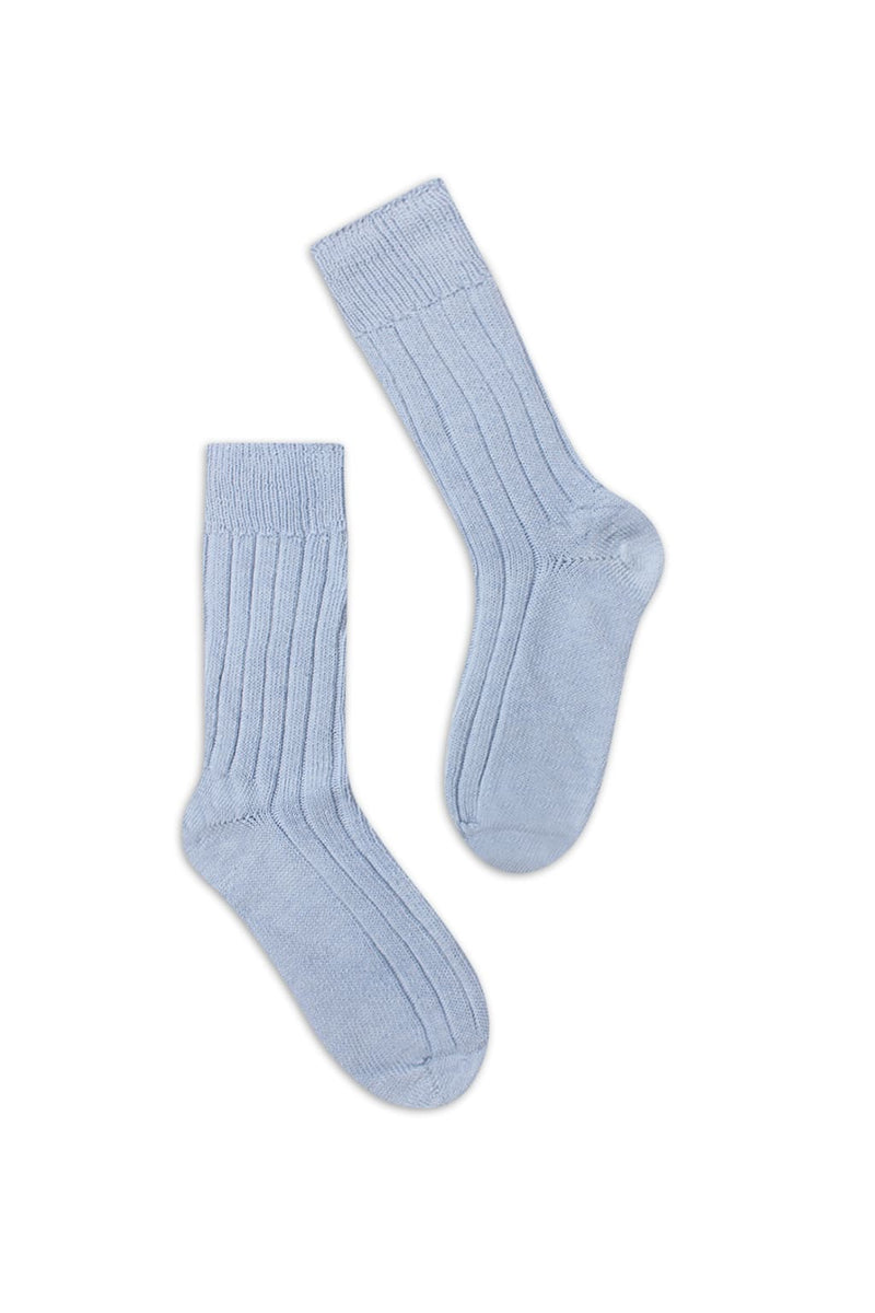 half british alpaca lounge socks in baby blue, pair laid flat on a background showing the ribbed knit texture and soft alpaca fibre - Baby Blue