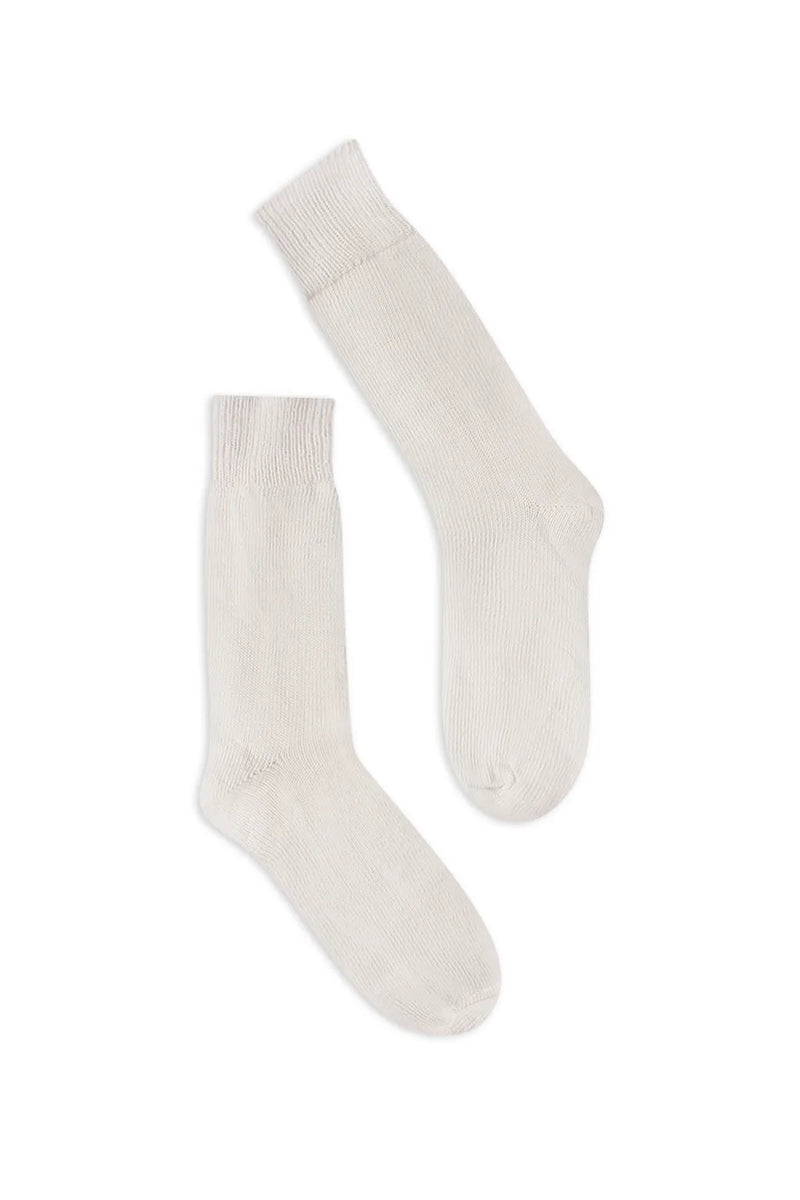 half british everyday alpaca socks in cream, pair laid flat on a background highlighting the soft alpaca wool texture and refined ribbed finish - Cream
