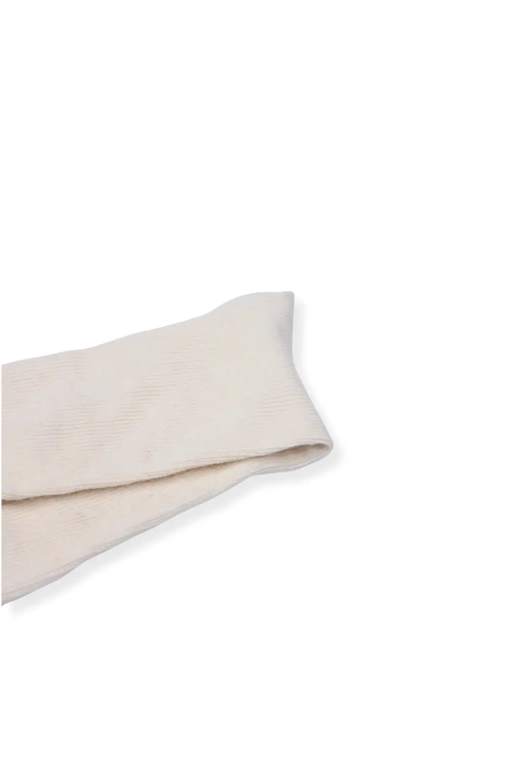 half british everyday alpaca sock in cream, folded on a background to highlight its natural alpaca wool texture and warm beige tone