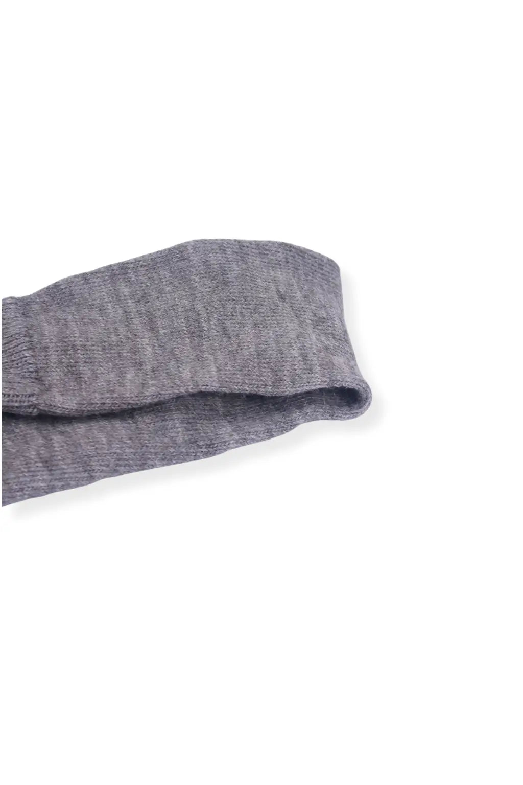 half british everyday alpaca sock in light grey, folded neatly on a background to highlight the soft alpaca wool texture and subtle ribbed knit