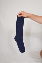 half british everyday alpaca sock in navy held up to show the fine ribbed knit and soft alpaca wool texture