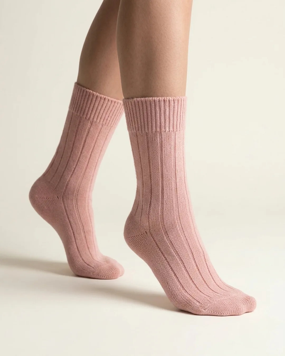 half british alpaca lounge socks in pink, lifestyle photo showing the ribbed knit texture and soft alpaca fibre